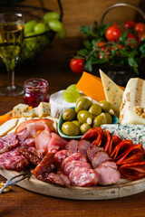 Meat and cheese board. A mix of exquisite cheeses and cold cuts from many countries.