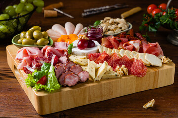 Meat and cheese board. A mix of exquisite cheeses and cold cuts from many countries.