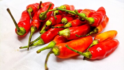 Cayenne pepper arranged on white background