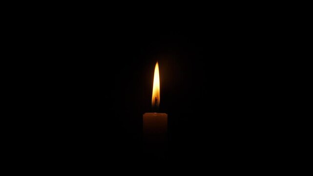  flame of burning candles isolated on a black background 4k