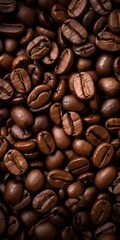 Fototapeta premium Roasted coffee beans close-up. Rich, dark brown texture. Food background