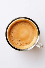 A close-up shot of a cup of coffee with cream and sugar