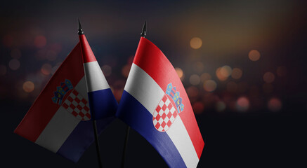 Small flags of the Croatia on an abstract blurry background
