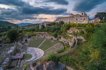Scenic View of the Main landmark of Sessa Aurunca at Sunset - Teatro Romano, Chiesa San Giovanni A Villa - Caserta, Campania, Italy - ancient roman ruins, historical Italian town in southern Italy