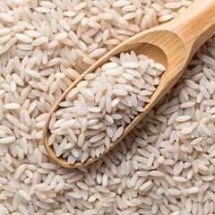 Raw Brown Rice Grains in Wooden Spoon