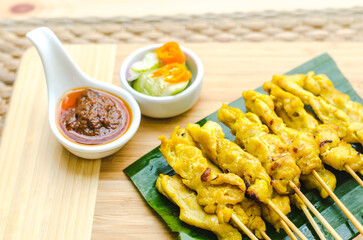 Satay with peanut sauce and cucumber salad, Bangkok, Thailand