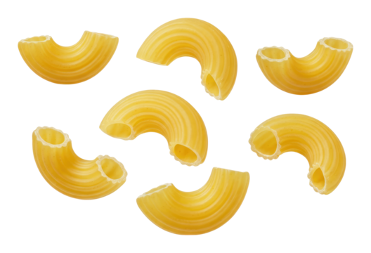 Close-up of individual pieces dry elbow macaroni pasta isolated on transparent background