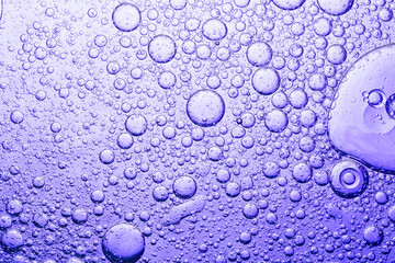 Macro purple oil bubble texture,oil with bubbles on Violet background. Abstract space purple violet background. Soft selective focus. macro of oil drops on water surface. copy space. 