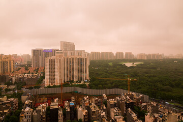Aerial view of Gurgaon,Haryana,India urban skyline .Residential apartments,commercial hub at sunset...
