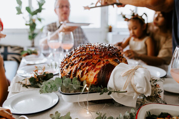 Glazed holiday ham with cloves served for dinner