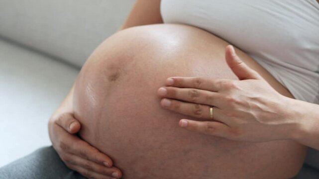 Pregnant concept. Pregnant woman hands on belly touching