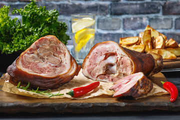 Smoked pork knuckle, ham hock on cutting board
