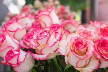 bouquet of white roses with pink petal edges