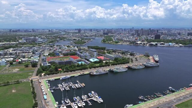 Aerial 4K footage of the harbour of Tainan in Taiwan with clear blue sky.