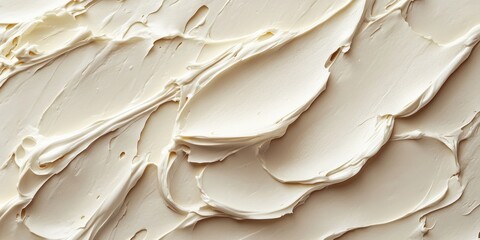Fototapeta premium Delicate cream surface reveals intricate textures; smooth yet subtly uneven, bathed in soft, warm beige tones