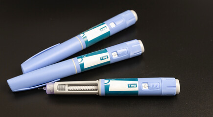 Ozempic Insulin injection pen on a dark background 