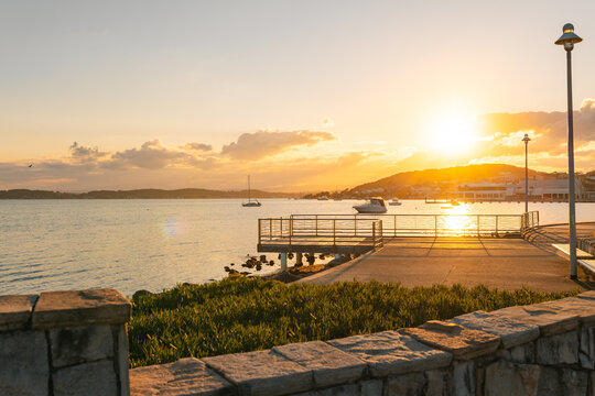 Small fishing jetty illuminated by late afternoon sunshine at Lake Macquarie