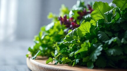 Fresh leafy greens and colorful herbs arranged on a round wooden cutting board, healthy ingredients