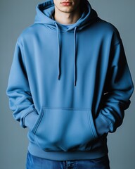 Man Wearing Blue Hoodie on City Street