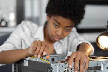 female computer repair engineer office
