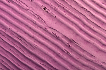 
plaster background with striped texture in pink color