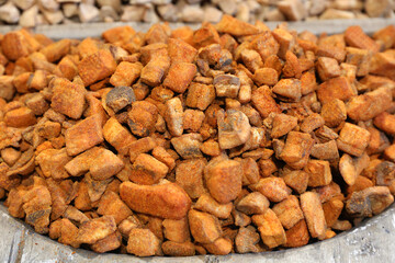 Heap of domestic salty fried pork greaves. Fatty junk food. Pork greaves for sale on farmers market...