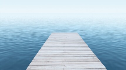 Fototapeta premium A serene wooden dock extending over calm blue water.