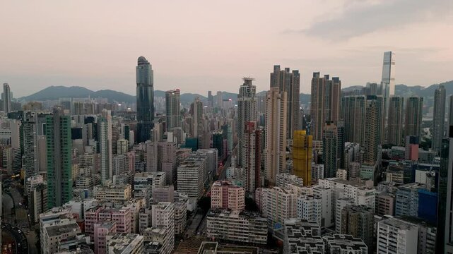 Mong Kok, Hong Kong: Aerial drone footage of the very crowded Sham Shui Po district in Mong Kok at sunset in Hong Kong Kowloon peninsula. Shot with a motion