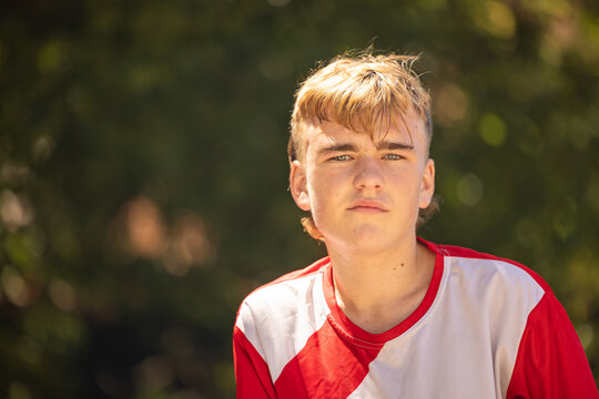 Close up portrait of teenage boy with serious expression