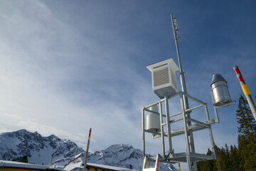 Alpine weather station against a blue sky