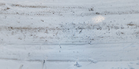 panorama view from above on texture of snow covered road in the winter forest