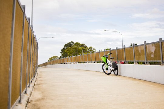 Public ride share bike parked on empty footpath on the Gold Coast