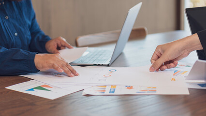 business collaboration, financial analysis, and teamwork, professionals reviewing financial reports...