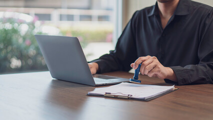 the concept of approval documentation, and business authorization, stamping a document indicating a...