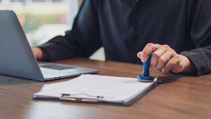 the concept of approval documentation, and business authorization, stamping a document indicating a...