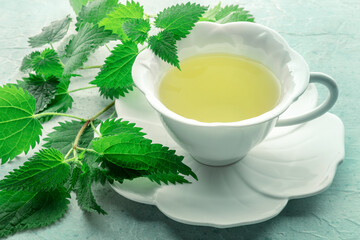 Nettle tea. Medicinal herbal tea with Urtica leaves. Fresh wild herb, an organic natural remedy