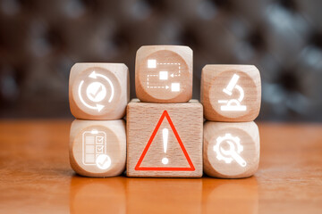 Illustration of incident management with symbols on wooden blocks, representing business solutions...