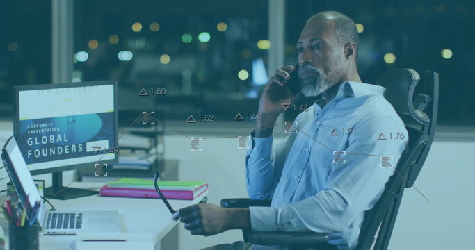 Image of financial data processing over african american businessman in office