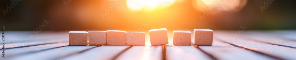 Aufkleber sunlit minimalist wooden domino sequence strategic crisis prevention display on textured surface - m
