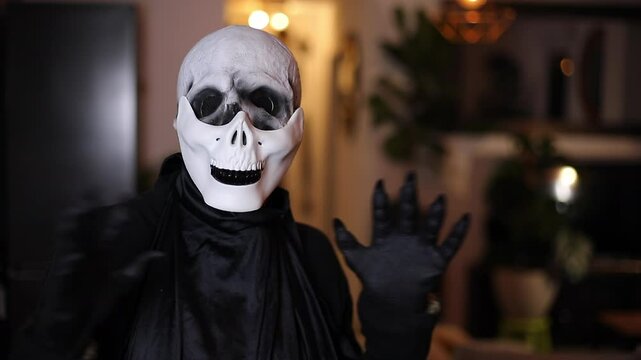 Spooky misterious man wearing a skeleton rubber mask 