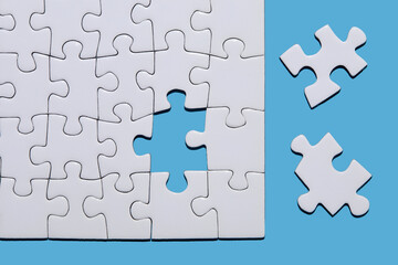 Blank puzzle pieces on blue background