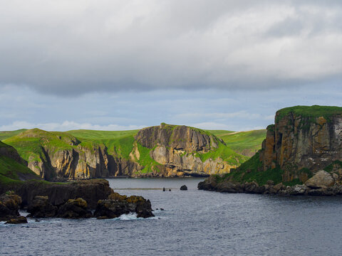 Storm clouds over cliffs and sea
