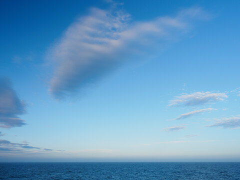Wispy clouds above sea