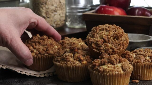 Baking apple crumb muffins for breakfast.  Using ingredients like eggs, flour, red apples, sugar, vanilla, baking powder, brown sugar and cinnamon.  