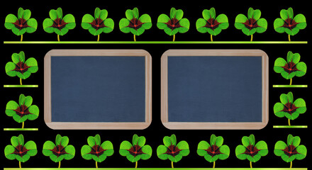 Glückskleeblätter mit Textfreiraum auf zwei Schiefertafeln
