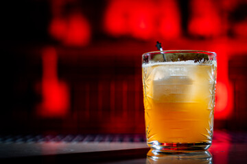 Focus on a glass with a beautiful tasty cocktail