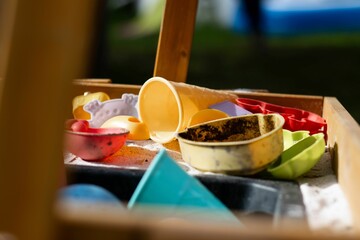 Colorful plastic toys in a wooden box