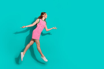 Full body photo of attractive teen woman running jump dressed stylish checkered pink clothes...