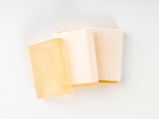 Hotel soap in a package isolated, hand made travel body care cosmetic, hotel shampoo kit