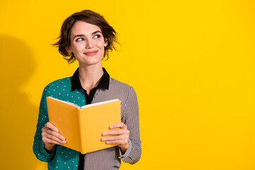 Photo of lovely adorable dreamy woman wear stylish clothes look empty space isolated on yellow color background